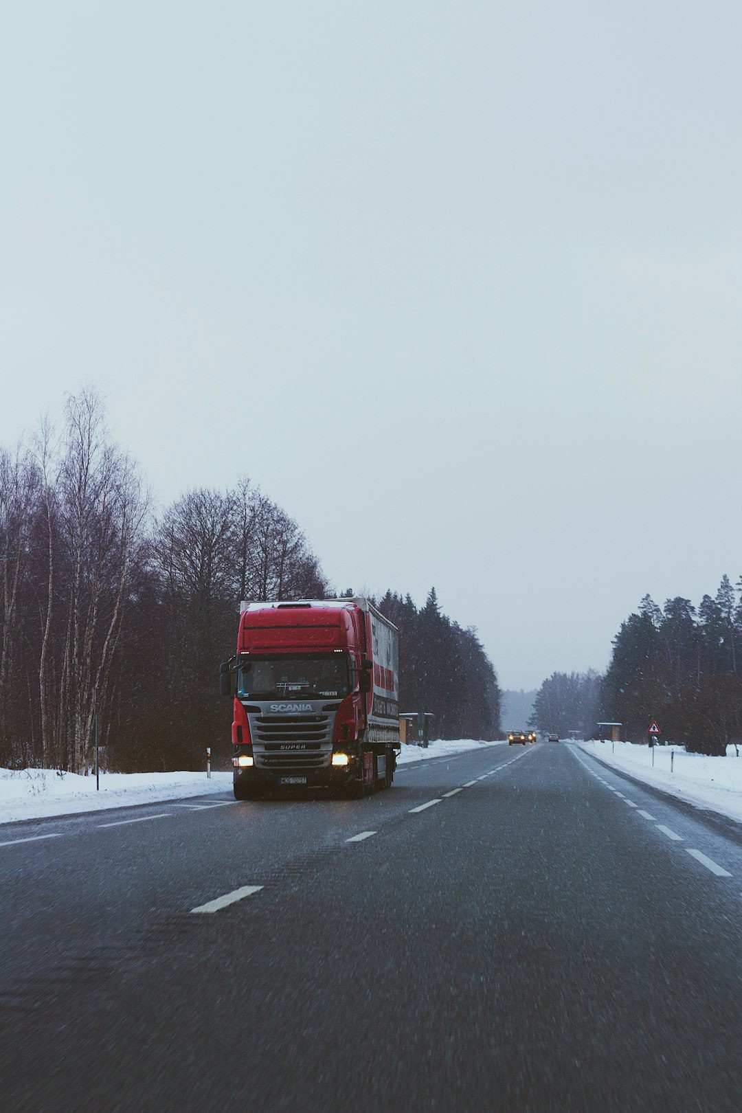 red-truck-on-road-during-daytime-u7rzjrb-zey